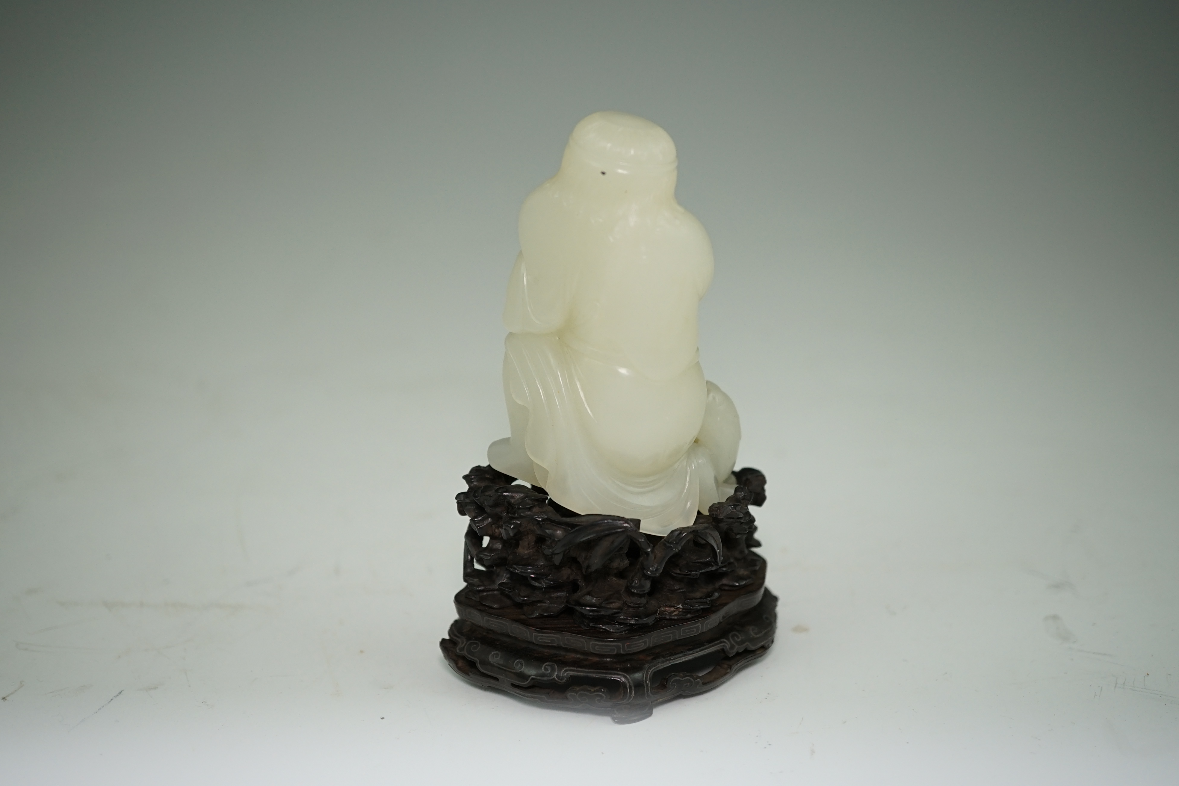 A fine Chinese white jade group of a bearded foreigner, 18th century